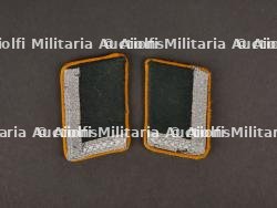 Patte de col. Collar tabs.