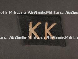 Patte de col KK. KK collar tab.