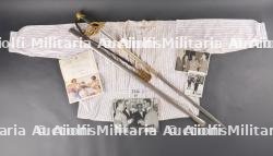 Ensemble sabre, documents et chemise de prisonnier du Colonel Leblanc des Chasseurs Ardennais. Set including sabre, documents and prisoner shirt of Colonel Leblanc from the Ardennes Chasseurs