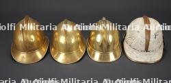Allemagne, lot de quatre casques de sapeurs-pompiers du debut du XXe siecle. Germany, set of four early 20th-century firefighter helmets.