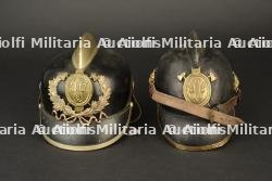 Allemagne, lot de deux casques de sapeurs-pompiers volontaires. Germany, set of two volunteer firefighter helmets. — photo 1