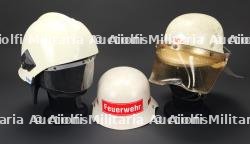 Allemagne, lot de trois casques de sapeurs-pompiers des annees 1960 a 2000. Germany, set of three firefighter helmets dating from the 1960s to the 2000s.