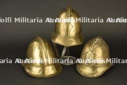 Alsace, lot de trois casques de pompiers en cuivre. Alsace, set of three copper firefighter helmets.