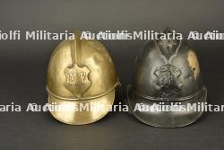 Alsace, lot de deux casques de sapeurs-pompiers en cuivre. Alsace, set of two copper firefighter helmets.