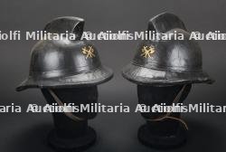 Belgique, lot de deux casques de sapeurs-pompiers de Bruxelles. Belgium, set of two Brussels firefighter helmets.
