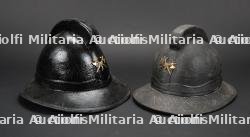 Belgique, lot de deux casques de sapeurs-pompiers de Bruxelles. Belgium, set of two Brussels firefighter helmets.