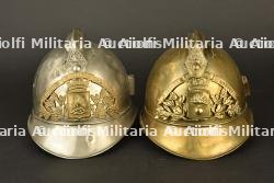 France, lot de deux casques de sapeurs-pompiers de Longwy. France, group of two firefighter helmets from Longwy.