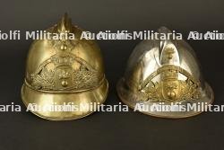France, lot de deux casques de sapeurs-pompiers de Miribel et de Virieu-le-Grand, dans l'Ain. France, group of two firefighter helmets from Miribel and Virieu-le-Grand, Ain.