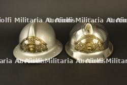 France, lot de deux casques de sapeurs-pompiers de Pont-d'Ain et de Neuville-sur-Ain. France, pair of firefighter helmets from Pont-d'Ain and Neuville-sur-Ain.