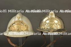 France, lot de deux casques de sapeurs-pompiers d'Artemare et de Saint-Rambert-en-Bugey, dans l'Ain. France, pair of firefighter helmets from Artemare and Saint-Rambert-en-Bugey, Ain.