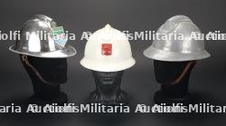 France, lot de trois casques Adrian de pompier et de defense passive. France, group of three Adrian firefighter and civil-defence helmets.