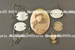 Plaques d’identite et souvenirs du genie et du corps de transport. Identity tags and memorabilia of the Engineers and Transport Corps.